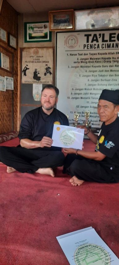 Kang Nick receiving Cimande teaching certificate from Aba Didih Supriadi. Kang Nick receiving Cimande teaching certificate from Aba Didih Supriadi.